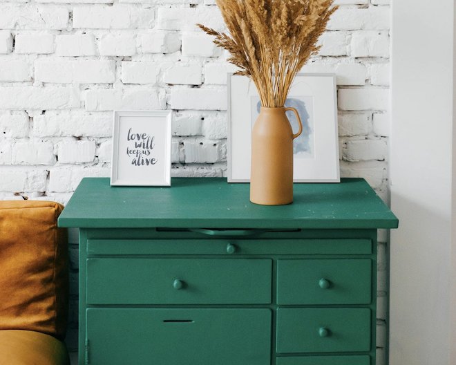 Drawer with vase and painting on it